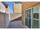 Back patio featuring block wall, vinyl fencing, and slider to indoor space at 7694 Hampton Park Ln, Las Vegas, NV 89113