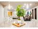 Open-concept living space featuring a kitchen island with granite countertops and stylish pendant lighting at 8113 Misty Canyon Ave, Las Vegas, NV 89113