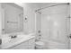 Bathroom features a white toilet, white sink, shower, and tile flooring at 8389 Charlton Valley Ct, Las Vegas, NV 89123