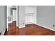 Bedroom featuring hardwood floors, closet and a staircase leading up at 8389 Charlton Valley Ct, Las Vegas, NV 89123