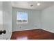 Bedroom featuring hardwood floors, a ceiling fan and window at 8389 Charlton Valley Ct, Las Vegas, NV 89123