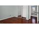 Bedroom featuring hardwood floors, closet and a window view to the outside at 8389 Charlton Valley Ct, Las Vegas, NV 89123