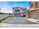 Beautiful two-story home with a spacious driveway and attached two-car garage, showcasing curb appeal at 8389 Charlton Valley Ct, Las Vegas, NV 89123