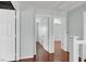 Hallway between rooms with dark wood floors at 8389 Charlton Valley Ct, Las Vegas, NV 89123
