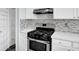 Close up of the gas stove and oven in the kitchen at 8389 Charlton Valley Ct, Las Vegas, NV 89123