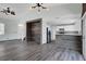 Open-concept living room with hardwood floors and an open kitchen at 8389 Charlton Valley Ct, Las Vegas, NV 89123