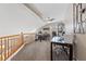 Bonus room with a pitched ceiling, carpet, and a railing overlooking the floor below at 8780 Autumn Wreath Ave, Las Vegas, NV 89129
