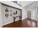 Inviting entryway with hardwood floors and decorative console table at 8780 Autumn Wreath Ave, Las Vegas, NV 89129