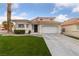 Charming two-story home with manicured lawn and desert landscaping at 8780 Autumn Wreath Ave, Las Vegas, NV 89129