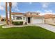 Charming two-story home with manicured lawn and desert landscaping at 8780 Autumn Wreath Ave, Las Vegas, NV 89129