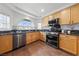 Well-equipped kitchen with stainless steel appliances and granite countertops at 8780 Autumn Wreath Ave, Las Vegas, NV 89129