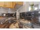 Close-up of a kitchen with a beautiful, brown marble countertop and white subway tile backsplash at 8780 Autumn Wreath Ave, Las Vegas, NV 89129