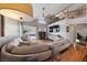 Spacious living room featuring a comfortable sectional and hardwood floors at 8780 Autumn Wreath Ave, Las Vegas, NV 89129