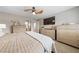 Spacious main bedroom with neutral walls, a ceiling fan, and lots of storage at 8780 Autumn Wreath Ave, Las Vegas, NV 89129