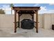 Outdoor cooking area with grill under a shaded pergola at 8780 Autumn Wreath Ave, Las Vegas, NV 89129