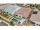 Aerial view of a home with a sparkling pool, spa, patio and well-manicured landscaping at 8956 Skye Treeline St, Las Vegas, NV 89166
