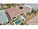 Aerial view of a home with a sparkling pool, spa, patio and well-manicured landscaping at 8956 Skye Treeline St, Las Vegas, NV 89166
