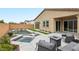 Resort-style backyard featuring a sparkling pool, spa, covered patio, and ample seating for outdoor entertaining at 8956 Skye Treeline St, Las Vegas, NV 89166