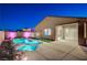 Modern backyard features a pool, spa, patio, and well-manicured landscaping at 8956 Skye Treeline St, Las Vegas, NV 89166