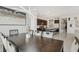 Open-concept dining area with stylish light fixture, seamlessly connected to the modern kitchen at 8956 Skye Treeline St, Las Vegas, NV 89166