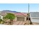 Attractive home exterior showcasing a well-manicured lawn, stylish driveway, and a convenient two-car garage at 8956 Skye Treeline St, Las Vegas, NV 89166