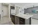 Bright, modern kitchen with an oversized island, sleek countertops, and an adjoining living area at 8956 Skye Treeline St, Las Vegas, NV 89166