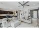 Open-concept living area flowing into the kitchen, featuring modern decor and comfortable seating at 8956 Skye Treeline St, Las Vegas, NV 89166