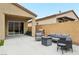 Covered patio featuring grill, outdoor seating, and a fire pit at 8956 Skye Treeline St, Las Vegas, NV 89166