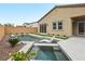 Sparkling backyard pool with sun shelf, spa, and lush landscaping at 8956 Skye Treeline St, Las Vegas, NV 89166