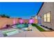 Inviting pool with spa, modern design, and colorful accent lighting offers a relaxing outdoor oasis at 8956 Skye Treeline St, Las Vegas, NV 89166