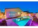 Relaxing pool and spa area, with modern landscaping and stylish patio furniture, perfect for evening enjoyment at 8956 Skye Treeline St, Las Vegas, NV 89166