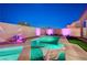 Inviting pool with spa, modern design, and colorful accent lighting offers a relaxing outdoor oasis at 8956 Skye Treeline St, Las Vegas, NV 89166