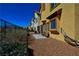 Fenced backyard with stone landscaping and a small patio at 9209 Tudor Park Pl, Las Vegas, NV 89145