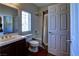 Bathroom with a toilet, sink, mirror and shower/tub at 9209 Tudor Park Pl, Las Vegas, NV 89145