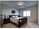 Bedroom with a queen bed with decorative pillows, side tables, and a bright window at 9209 Tudor Park Pl, Las Vegas, NV 89145
