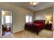 Cozy bedroom with a queen bed, an ensuite bathroom, and ample natural light at 9209 Tudor Park Pl, Las Vegas, NV 89145