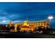Exterior shot of a bright casino building at night with parked cars and streetlights at 9209 Tudor Park Pl, Las Vegas, NV 89145