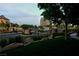 Landscaped community entrance with secure gates and lush greenery at 9209 Tudor Park Pl, Las Vegas, NV 89145