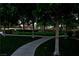 Lush community park featuring a walking path, mature shade trees, manicured lawn, and shaded gazebo at 9209 Tudor Park Pl, Las Vegas, NV 89145
