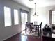 Bright dining area with wood table and chairs, complemented by natural light at 9209 Tudor Park Pl, Las Vegas, NV 89145