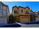 Charming two-story home featuring an attached two-car garage and well-maintained front yard at 9209 Tudor Park Pl, Las Vegas, NV 89145