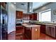 Gourmet kitchen featuring stainless steel appliances, granite countertops, and a center island at 9209 Tudor Park Pl, Las Vegas, NV 89145