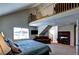 Comfortable bedroom with fireplace, TV, and a cozy sitting area at 9209 Tudor Park Pl, Las Vegas, NV 89145