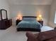 Cozy main bedroom featuring a comfortable bed and ample natural light at 9209 Tudor Park Pl, Las Vegas, NV 89145