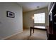 Bright office space with a desk, bookcase and large windows at 9209 Tudor Park Pl, Las Vegas, NV 89145