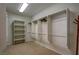 Spacious walk-in closet with shelving and rods for ample storage at 9209 Tudor Park Pl, Las Vegas, NV 89145