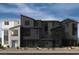 New townhouse complex showing modern architectural details and landscaping at 9243 Stonewall Ridge Ct, Las Vegas, NV 89148