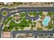 Aerial view of community amenities, pool, and landscaped common areas surrounded by residential buildings at 9312 Straw Hays St # 103, Las Vegas, NV 89178