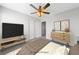 Brightly lit bedroom with a ceiling fan and view at 9312 Straw Hays St # 103, Las Vegas, NV 89178