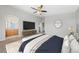 Spacious main bedroom features a ceiling fan, plush carpet, and a decorative rug at 9312 Straw Hays St # 103, Las Vegas, NV 89178